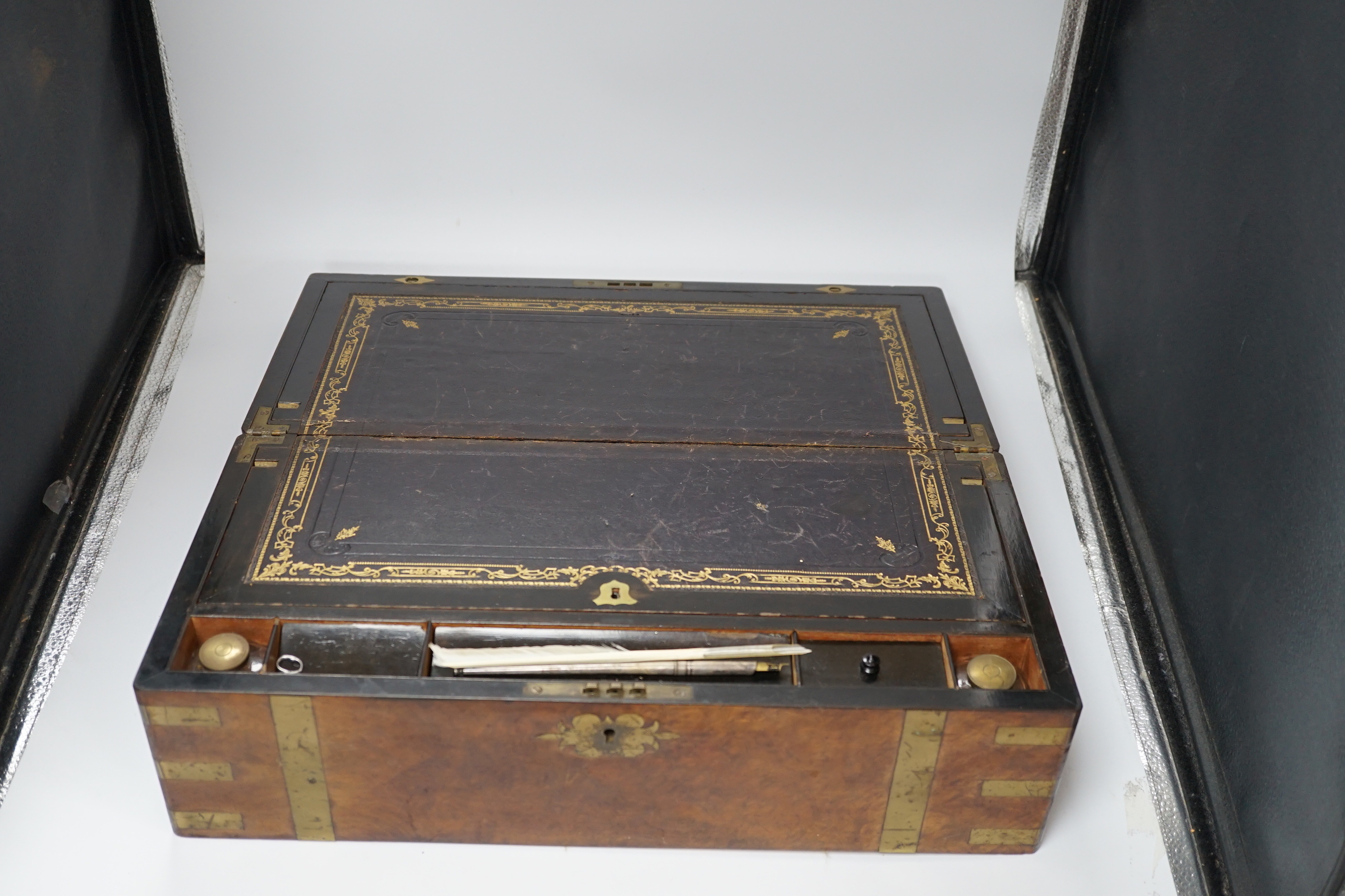 A Victorian walnut brass bound writing slope, 50cm wide x 25cm deep x 18cm high